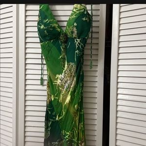 Beautiful dress with tie on the back. Only worn once. Jennifer Lopez inspired.